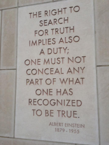 A stone wall with an inscription carved into it, reading: "The right to search for truth implies also a duty; one must not conceal any part of what one has recognized to be true." - Albert Einstein, 1879-1955. 